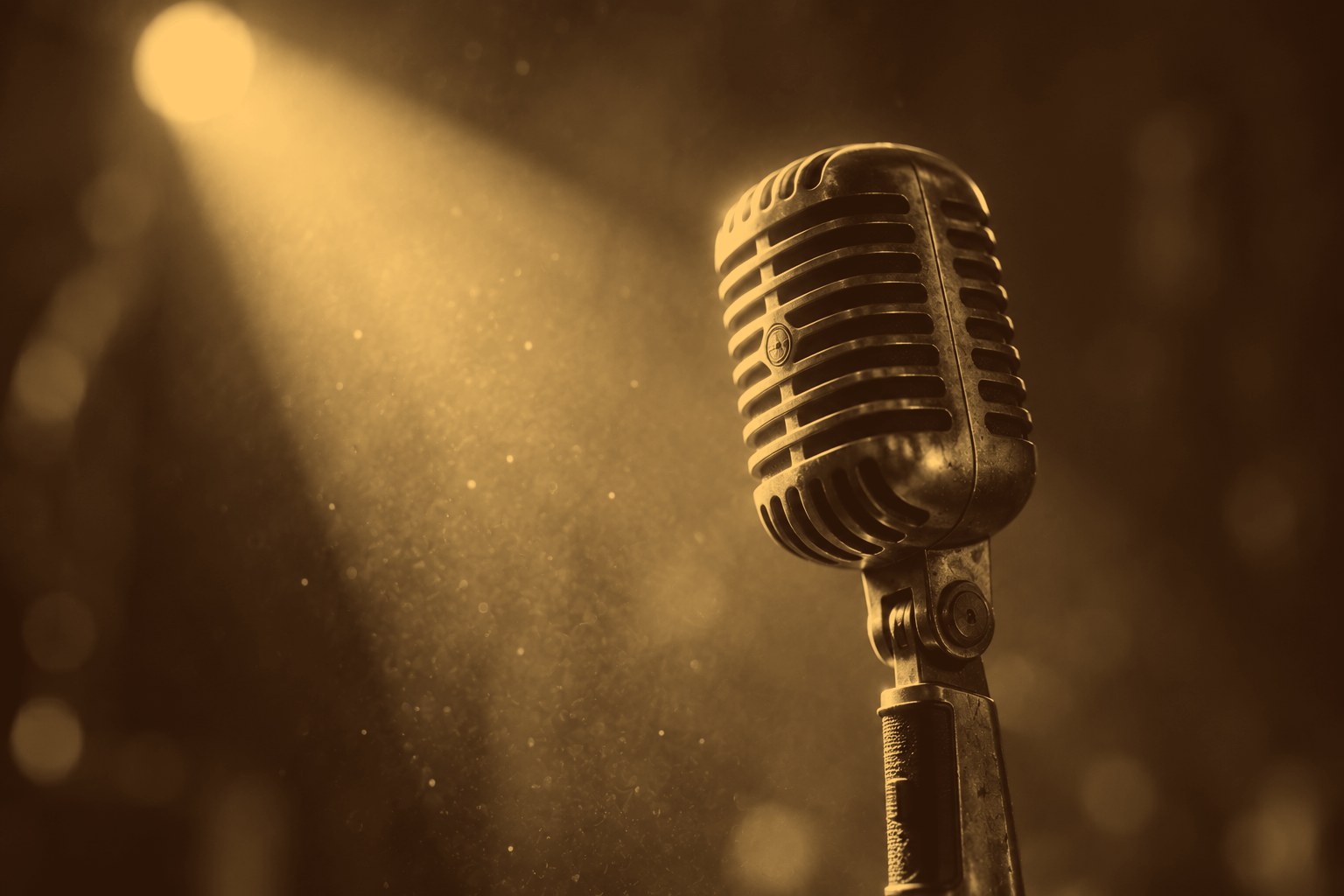 Vintage microphone lit by a spotlight
